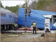  ?? CHRIS SEWARD — THE NEWS & OBSERVER VIA AP, FILE ?? A northbound Amtrak train collided with an oversized truck carrying an electrical building when the truck got stuck on the tracks at an intersecti­on in Halifax, N.C. The federal agency that oversees railroads is asking digital mapping companies to...