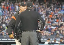  ?? Jeff Chiu / Associated Press ?? Bruce Bochy argues with umpire Chris Conroy after the Pirates’ Andrew McCutchen homered in the second inning.