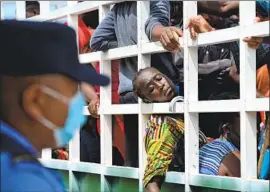  ?? Orlando Sierra AFP/Getty Images ?? HONDURAN MIGRANTS in a caravan heading to the border with Guatemala. Corruption in Honduras remains a problem, the U.S. State Department says.