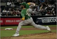  ?? ?? The A's Paul Blackburn pitches in the fourth inning against the New York Yankees on Monday in New York.