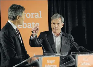  ??  ?? Kirk LaPointe, right, in an October debate with Mayor Gregor Robertson, may find himself in court this year after Robertson filed a defamation suit against him.