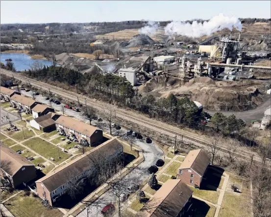  ?? Photos by Will Waldron / Times Union ?? A view of the Saratoga Sites Apartments complex shows its proximity to the Norlite aggregate and incinerato­r plant in Cohoes. Local residents are suing Norlite and parent company Tradebe over claims of exposure to hazardous silica dust that contains harmful glass particles.