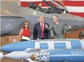  ??  ?? Gen. Todd Canterbury, 56th fighter wing commander, shows munitions to Rep. Martha McSally and President Donald Trump on Friday at Luke Air Force Base. MICHAEL CHOW/THE REPUBLIC