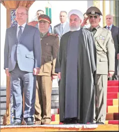  ??  ?? Salih stands with Rouhani during an official reception ceremony in Tehran, Iran. — Reuters photo