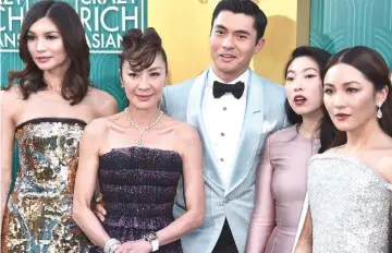  ?? — AFP photo ?? During the movie’s premiere in Hollywood were cast members (from left) Gemma Chan,Tan Sri Michelle Yeoh, Henry Golding, Awkwafina and Constance Wu.