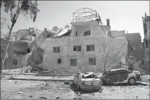  ?? AP ?? This photo released by the Syrian official news agency SANA shows damaged cars along the road to the airport in southeast Damascus, Syria, on Sunday.