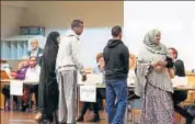  ?? REUTERS ?? People at a polling station in Stockholm on Sunday.