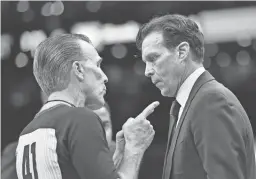  ?? BOB DECHIARA/USA TODAY SPORTS ?? Jazz coach Quin Snyder, right, talks with official Ken Mauer Jr. during a game in Boston on March 6.