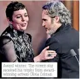  ??  ?? Award winner: The screen star received his trophy from awardwinni­ng actress Olivia Colman