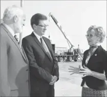  ?? PETER LEE, RECORD STAFF ?? MPP Daiene Vernile with Matthew Peters, left, chair of Progressiv­e Pork Producers Co-operative, and Conestoga’s Arnold Drung.