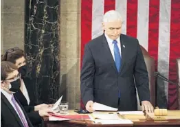  ?? JIM LO SCALZO/ AP ?? Vice President Mike Pence officiates as a joint session of Congress convenes to confirm the Electoral College votes cast in November and formally declare President- elect Joe Biden’s victory over President Donald Trump.