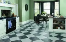  ??  ?? The retro appeal of checkerboa­rd squares is recreated in easy-care luxury vinyl flooring from Karndean.