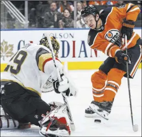  ?? Jason Franson The Associated Press ?? Marc-Andre Fleury makes a second-period save on Oilers forward Ty Rattie in the Knights’ 2-1 loss on Saturday in Edmonton, Alberta.