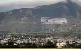  ?? Photograph: Roy Issa/AFP/Getty Images ?? The Kyrenia mountain range north of Nicosia, with the flags of Turkey and the selfprocla­imed Turkish Republic of Northern Cyprus painted on the mountain.