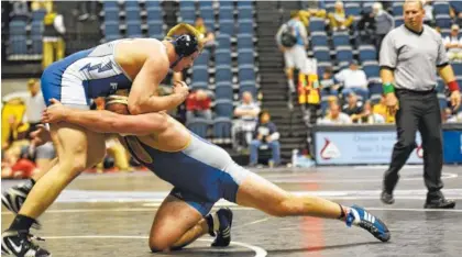  ?? STAFF FILE PHOTO BY TIM BARBER/TIMES FREE PRESS ?? UTC’s Conner Tolley shoots to take down Air Force’s Marcus Maleck during a 285-pound match at the Southern Scuffle in January 2017 at McKenzie Arena.