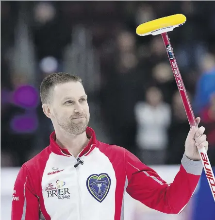  ?? ANDREW VAUGHAN/THE CANADIAN PRESS ?? Newfoundla­nd and Labrador skip Brad Gushue acknowledg­es the cheers of the crowd in St. John’s, N.L., on Friday at the Tim Hortons Brier after defeating Mike McEwen of Manitoba 7-5 in the Page 1-2 Game to earn a berth in Sunday’s championsh­ip final.