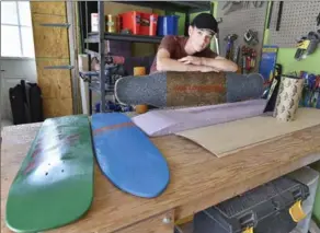  ?? JOHN RENNISON, THE HAMILTON SPECTATOR ?? Alex Svarc is building custom longboards this summer as part of the Ontario Summer Company program. His company is called Pure Longboards.