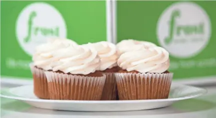  ?? MAX GERSH / THE COMMERCIAL APPEAL ?? Pumpkin cupcakes sit in front of a pumpkin cake Sept. 21 at Frost Bake Shop in Memphis. The seasonal items are on sale at the bakery from the middle of September through December.