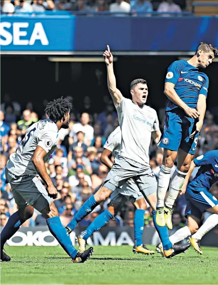  ??  ?? Flying high: Alvaro Morata leaps the highest to score Chelsea’s second goal