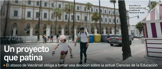  ?? LOURDES DE VICENTE ?? Una niña y un hombre patinan con el edificio de Valcárcel al fondo