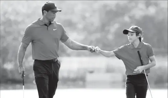  ?? ?? Tiger Woods of the U.S. and his son Charlie on the 12th hole the during second round REUTERS/Joe Skipper