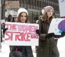  ?? MAX HERMAN/FOR THE SUN-TIMES ?? Participan­ts in the Young Women’s March downtown show off their signs.