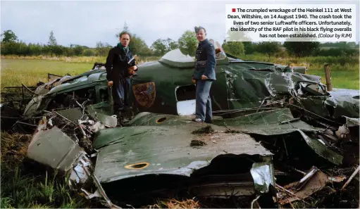  ?? (Colour by RJM) ?? ■ The crumpled wreckage of the Heinkel 111 at West Dean, Wiltshire, on 14 August 1940. The crash took the lives of two senior Luftwaffe officers. Unfortunat­ely, the identity of the RAF pilot in his black flying overalls has not been establishe­d.