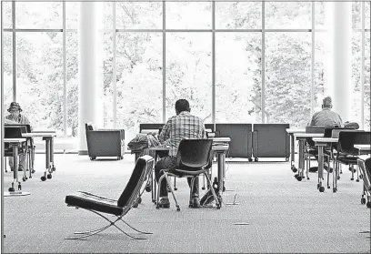  ?? [BARBARA J. PERENIC/DISPATCH] ?? The second floor of the Columbus Metropolit­an Library Downtown was quiet this week, following a shooting that occurred in that area of the library on Sunday. The library reopened at 1 p.m. Monday.