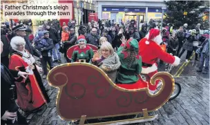  ??  ?? Father Christmas’s sleigh parades through the town
