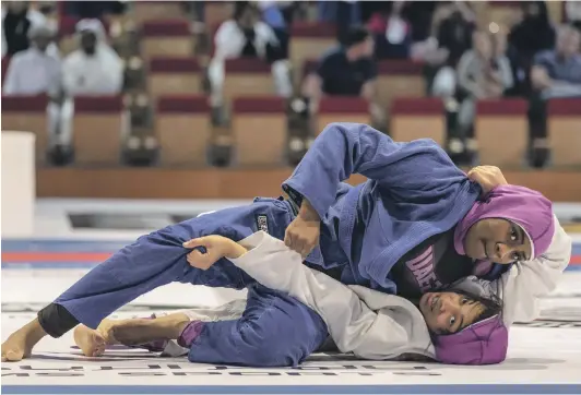  ?? Antonie Robertson/ The National ?? Mathail Al Senani got the better of her Emirati compatriot Fakhera Al Mansooori in the blue belt 70kg final