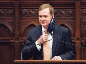  ?? Jessica Hill / Associated Press ?? Connecticu­t Speaker of the House Matt Ritter, D-Hartford, pulls up his mask during a session at the state Capitol on April 19.