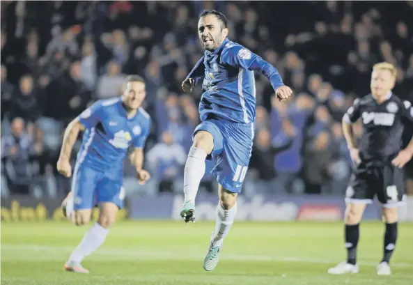  ??  ?? Erhun Oztumer celebrates a goal for Posh.