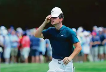  ?? AFP ?? Irishman Rory McIlroy shows his frustratio­n on the ninth hole during the first round of the 2016 PGA Championsh­ip at Baltusrol Golf Club, in Springfiel­d, New Jersey. He fired a birdie-free 74, his worst-ever start in an event he has won two of the past...