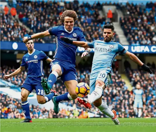  ?? — Reuters ?? Tough luck: Manchester City’s Sergio Aguero (right) picked up a red card that will keep him out of the English Premier League until after Christmas.