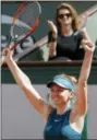  ?? MICHEL EULER — THE ASSOCIATED PRESS ?? Simona Halep raises her arms after defeating Garbine Muguruza during their semifinal Thursday in Paris. Halep won 6-1, 6-4.