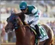  ?? BENOIT PHOTO VIA AP ?? In a photo provided by Benoit Photo, Accelerate and jockey Joel Rosario win the Grade I, $1,000,000 TVG Pacific Classic horse race Saturday, Aug 18, 2018, at Del Mar Thoroughbr­ed Club in Del Mar, Calif.