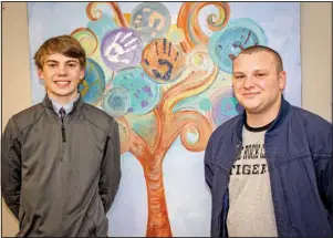  ?? (Arkansas Democrat-Gazette/Cary Jenkins) ?? Ted Penick (left), a junior at Catholic High, and Phillip Byrd, a Central High junior on track to graduate early, are two of 58 Champions of Hope, volunteeri­ng time and raising money for The Centers for Youth and Family.