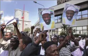  ?? KHALIL SENOSI — THE ASSOCIATED PRESS ?? In this Jan. 15, 2010, photo, placards showing Sheik Abdullah el-Faisal are held up by demonstrat­ors in Nairobi, Kenya, protesting the arrest of the radical Jamaican-born Muslim cleric who was jailed because Kenyan authoritie­s said el-Faisal was a...