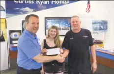  ?? Contribute­d Photo ?? From left, Ed DeMarseill­es, COO of Curtiss Ryan Honda, Jacquelyn Hesse and Robert Hesse