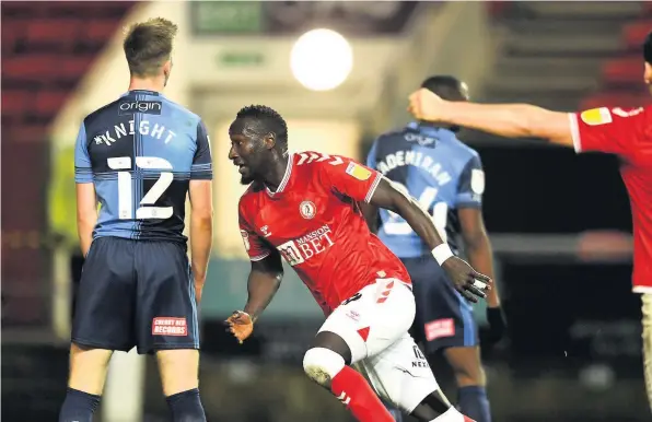  ??  ?? Famara Diedhiou races away to celebrate after scoring a late winner for Bristol City in Saturday’s Championsh­ip game at Ashton Gate