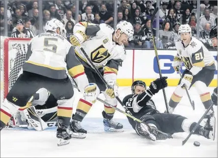  ?? Photograph­s by Robert Gauthier Los Angeles Times ?? TREVOR LEWIS of the Kings hits the ice as he tries in vain to score on the Golden Knights in the third period.