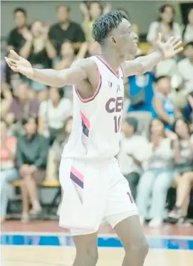  ?? PHOTOGRAPH COURTESY OF UCAL ?? ABDUL-WAHAB Olusesi celebrates after delivering 22 points and 19 rebounds to lead Centro Escolar University to an 80-73 win over Diliman College in Game 1 of their UCAL-PG Flex Linoleum Season 6 best-of-three title series.