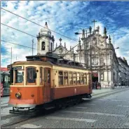  ?? ERIK NILSSON / CHINA DAILY ?? A vintage tram runs in front of centuries-old architectu­re on the streets of Porto. The city was recently voted Best European Destinatio­n of 2017.