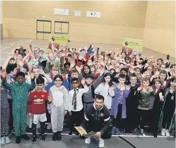  ?? ?? SAFC star Bailey Wright joins primary school children on World Book Day. Photograph: Alan Hewson.