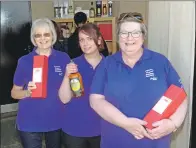  ?? 25_c22springb­ank14 ?? Selling staff Christmas bottles from left were: Mairi Sih, Ainsley Burnfield and Catherine McDougall.