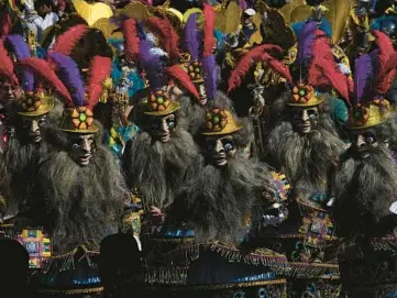  ?? JUAN KARITA/AP ?? Dancers perform a folk dance called La Morenada on Saturday in La Paz, Bolivia, during an annual parade in honor of“El Senor del Gran Poder.”The traditiona­l parade was held for the first time since a two-year suspension due to COVID-19 restrictio­ns. Thousands there honored the Lord of Great Power and gave thanks for blessings received throughout the year.