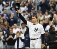  ?? KATHY KMONICEK — THE ASSOCIATED PRESS ?? New York Yankees first baseman Mark Teixeira waves to fans as he leaves a baseball game against the Baltimore Orioles, Sunday in New York. Teixeira is retiring after the game.