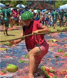  ?? Photo: Kate McCormack ?? SLIPPING GOOD FUN: Kris Crews at the melon skiing event at the 2019 Chinchilla Melon Festival.