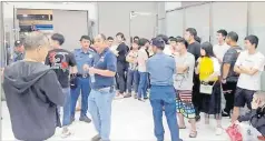  ?? Picture: AP ?? Foreign nationals, mostly Chinese are herded in a room during a raid of their company premises late on Wednesday in Manila, Philippine­s.