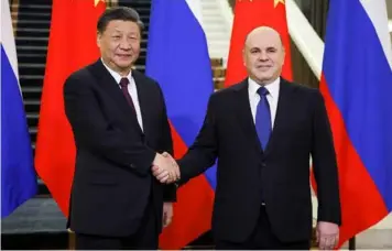  ?? TASS Photo ?? Chinese President Xi Jinping and Russian Prime Minister Mikhail Mishustin